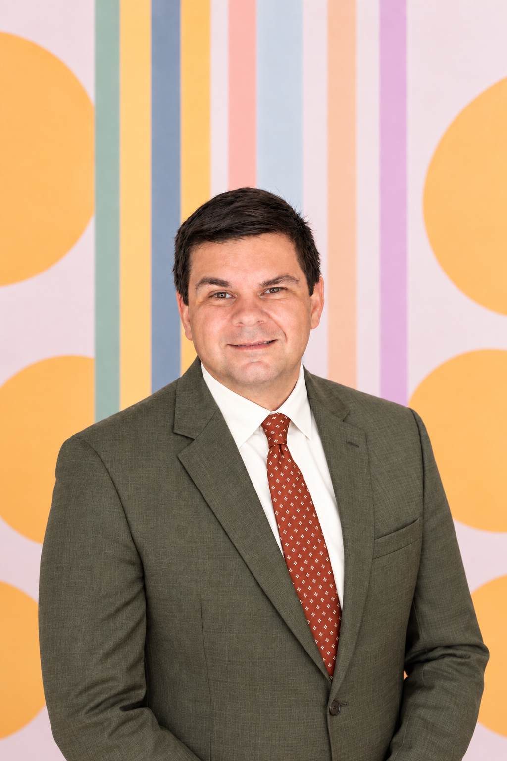 Christopher Vercammen, MD, in an olive suit